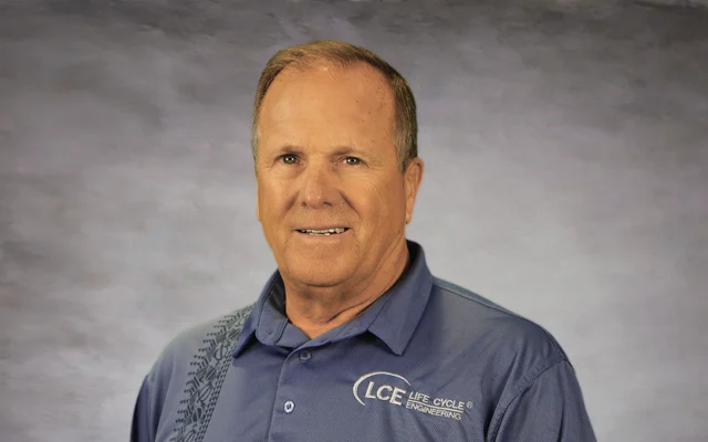 Man in a blue polo shirt with the "LCE Life Cycle Engineering" logo, standing against a plain background.