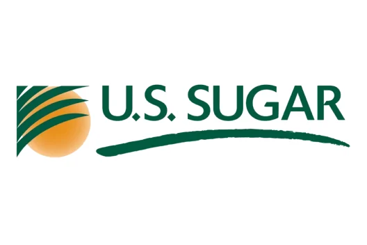 U.S. Sugar logo with a green stylized leaf design on an orange circle and the company name in bold green letters.